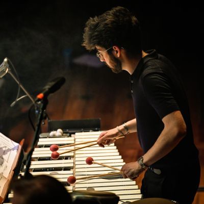 Percussion student on stage playing the xylophone